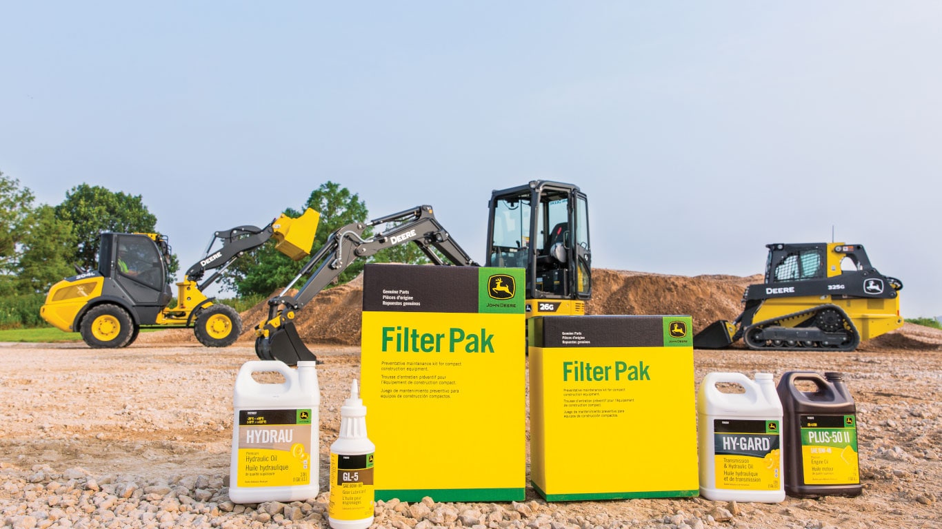 Ensemble de filtres Filter Pak John Deere avec plusieurs machines de construction différentes en arrière-plan
